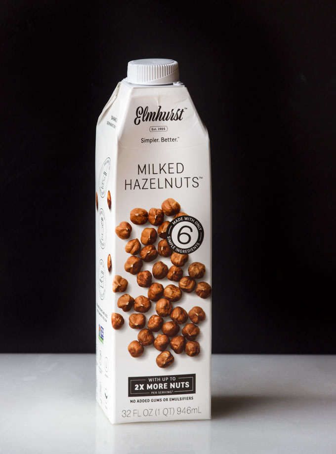 Elmhurts Milked Hazelnuts Bottle with Black Background