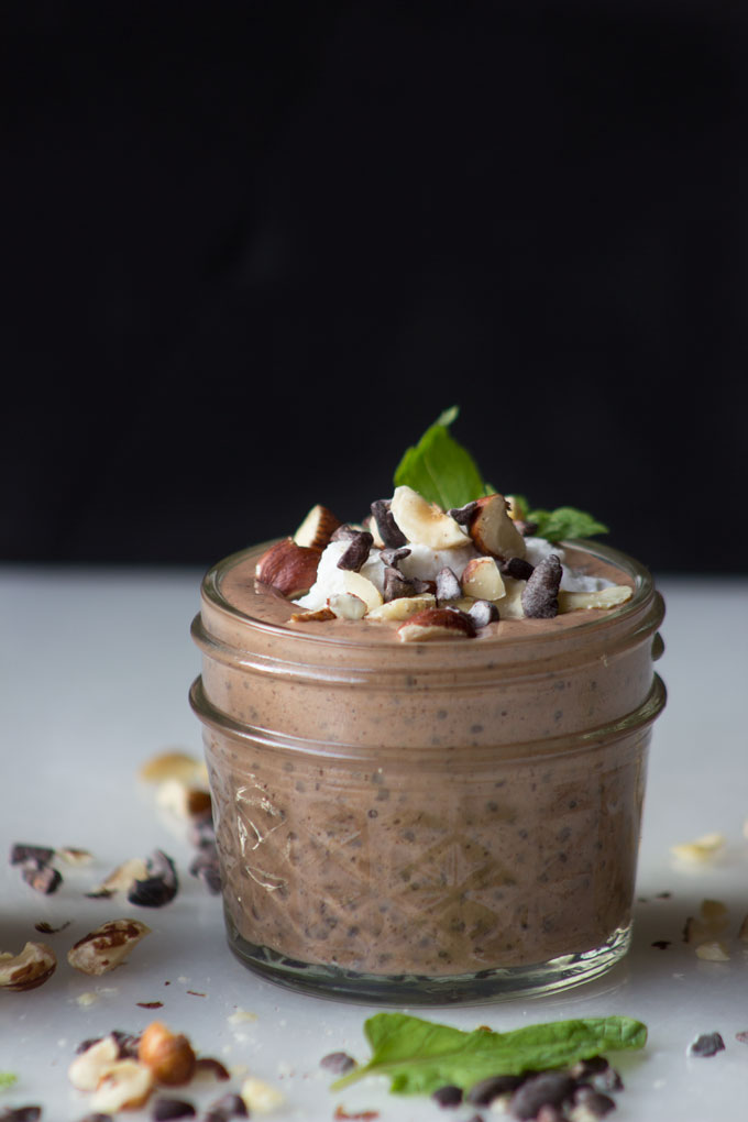 Side view of Chocolate Hazelnut Chia + Flax Pudding {Paleo + Vegan} with Cacao Nibs toppings
